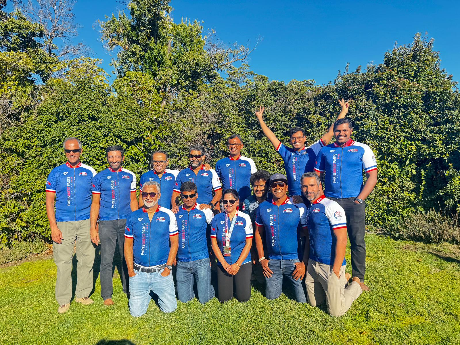 Team Asha riders together outdoors